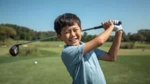 Boy on the golf course 7-11 years old